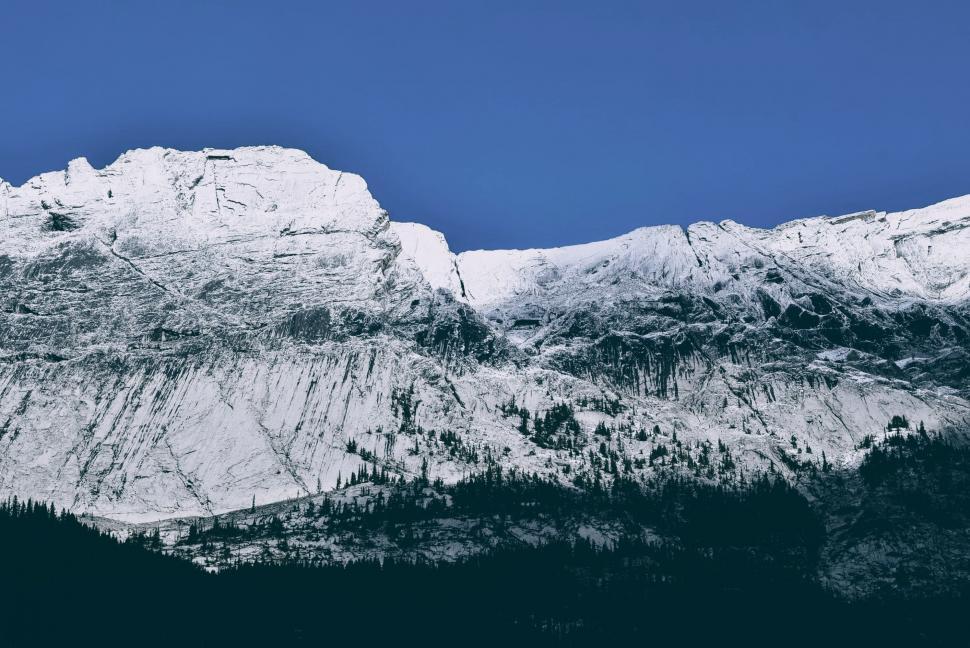 Free Image of Snow-Covered Mountain Under Blue Sky 