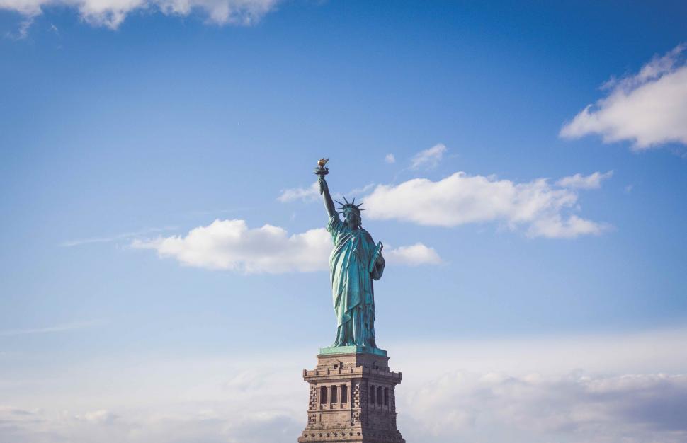 Free Image of Statue of Liberty Towering Above Clouds 