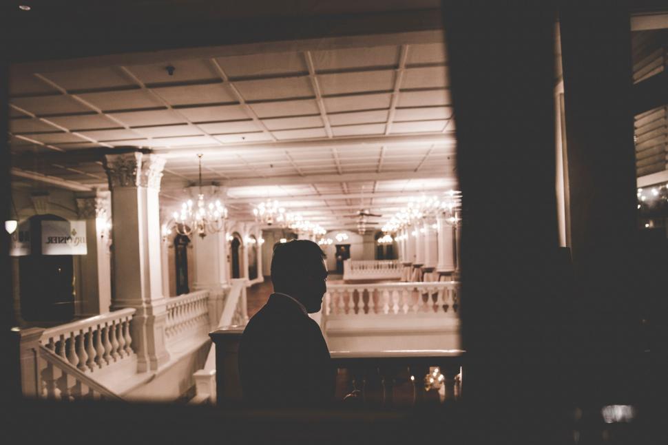 Free Image of Man Standing in Front of Staircase in Building 