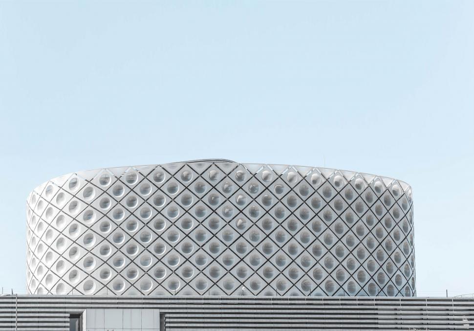 Free Image of Large White Building With Circular Design 