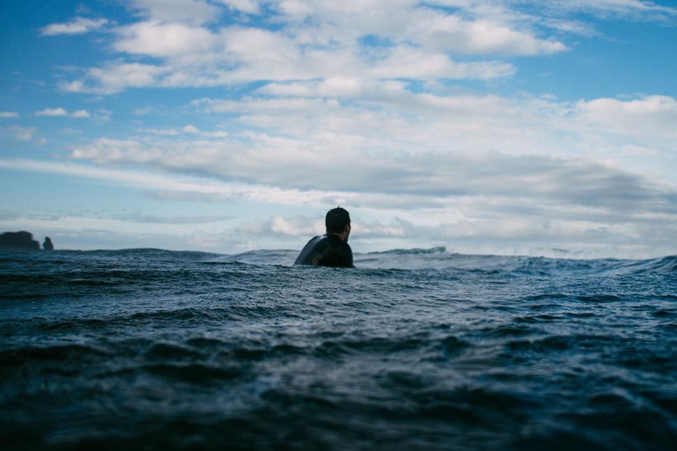 Free Image of Person Surfing in the Water With a Surfboard 