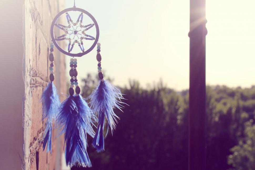 Free Image of Wooden Pole With Hanging Wind Chime 