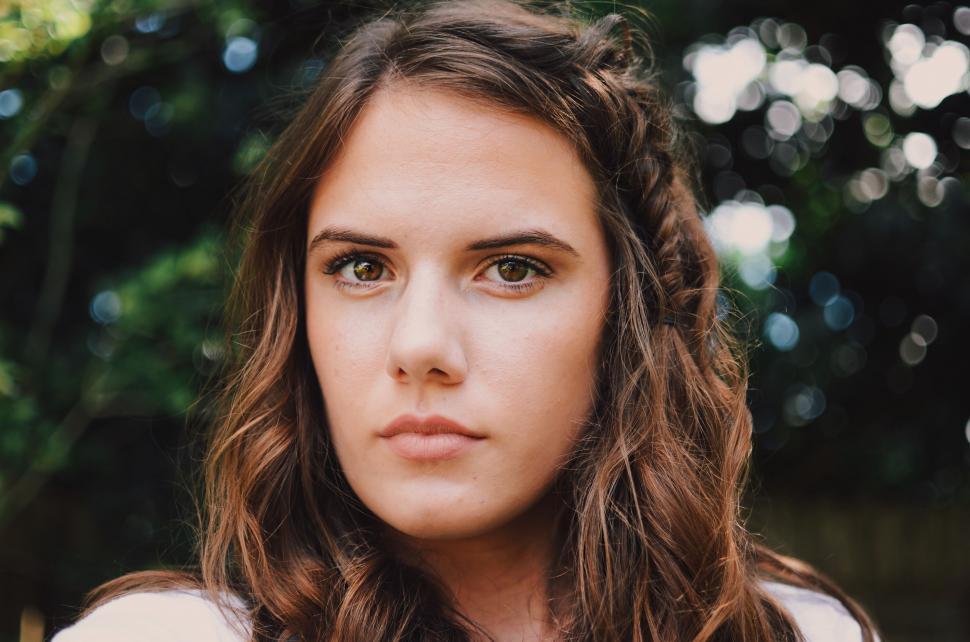 Free Image of Woman With Long Hair Looking at Camera 