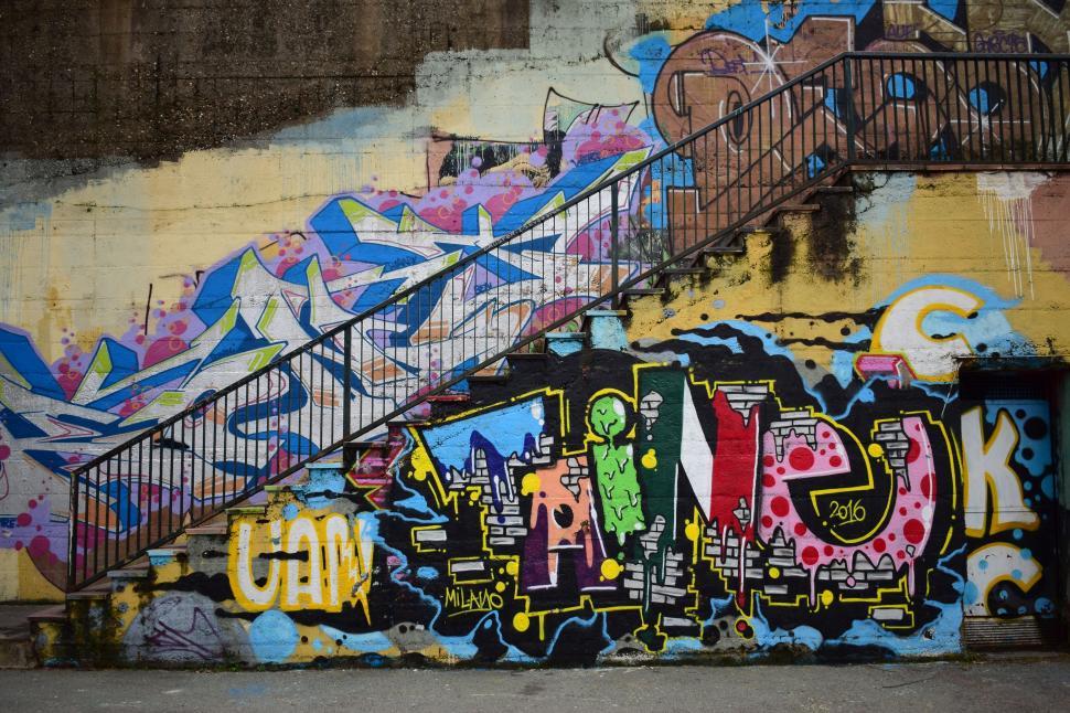 Free Image of Graffiti Covered Wall With Staircase 