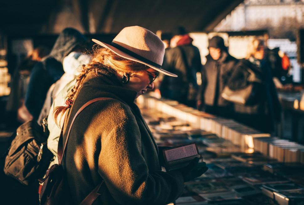 Free Image of Woman in Hat Reading Book 