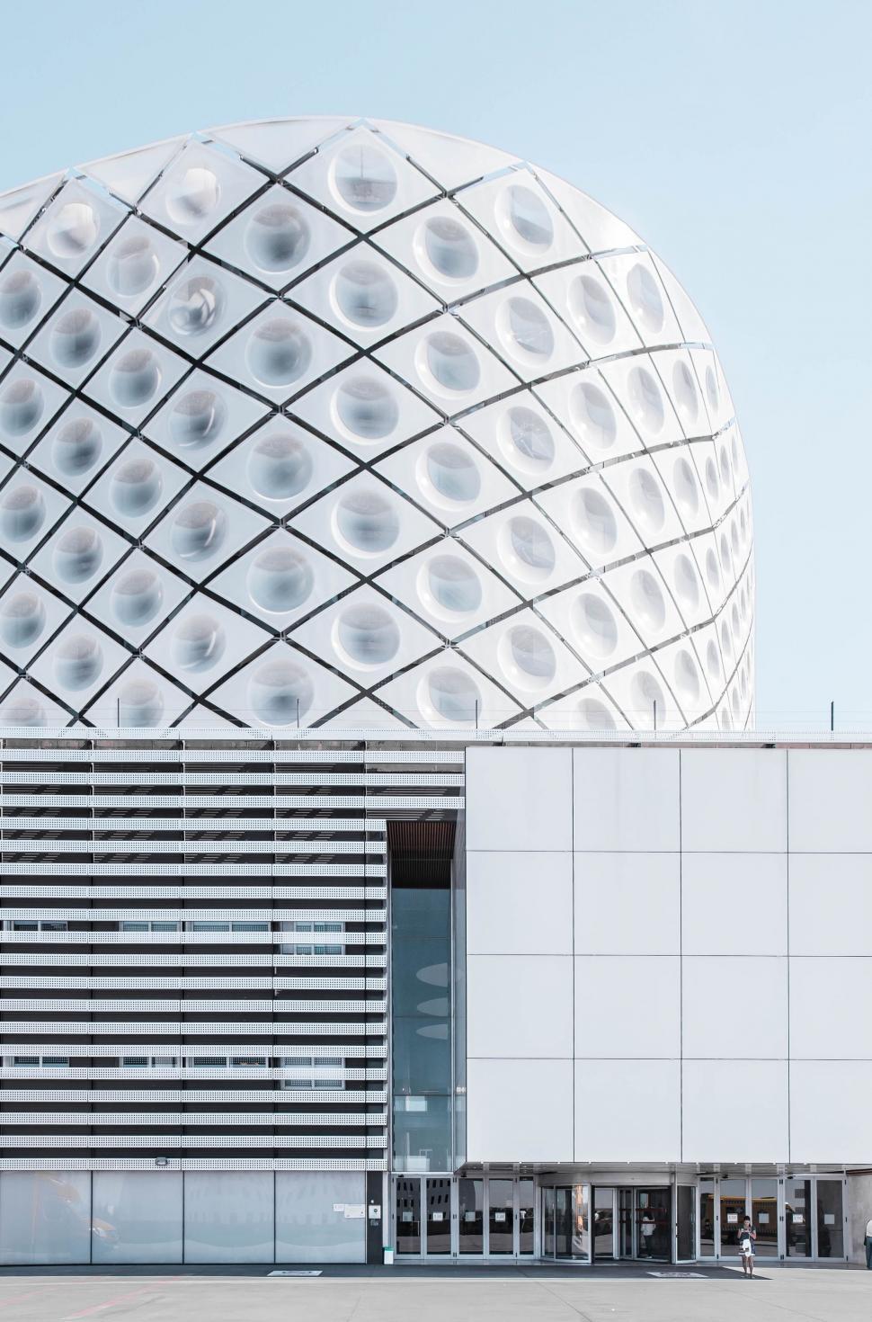 Free Image of Large White Building With Circular Structure on Top 