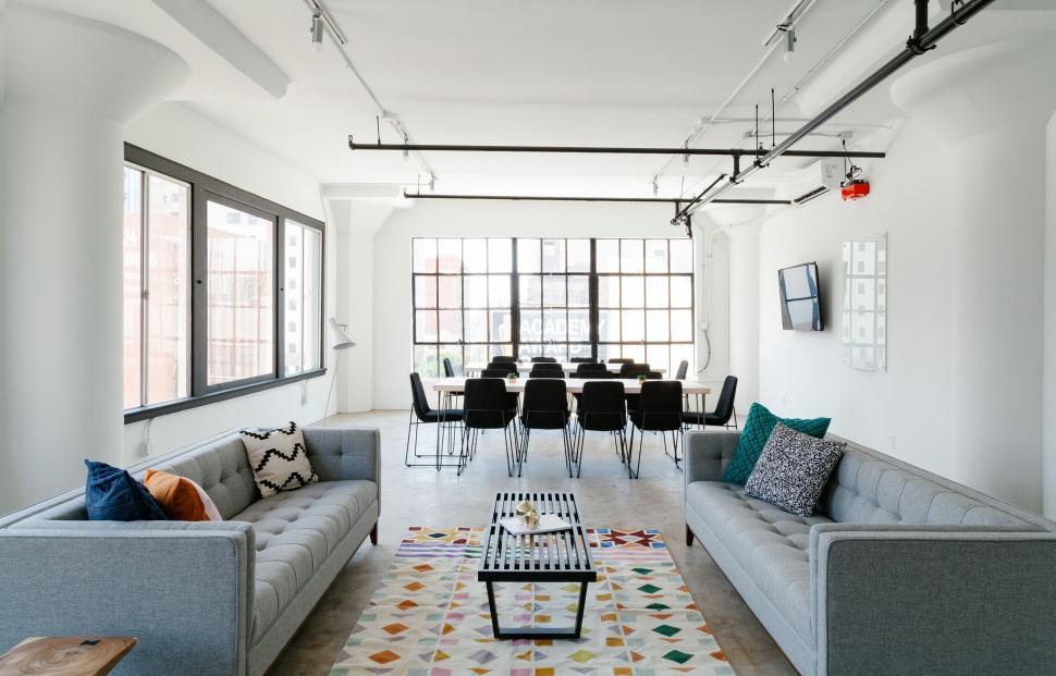 Free Image of Spacious Living Room With Abundant Furniture and Windows 