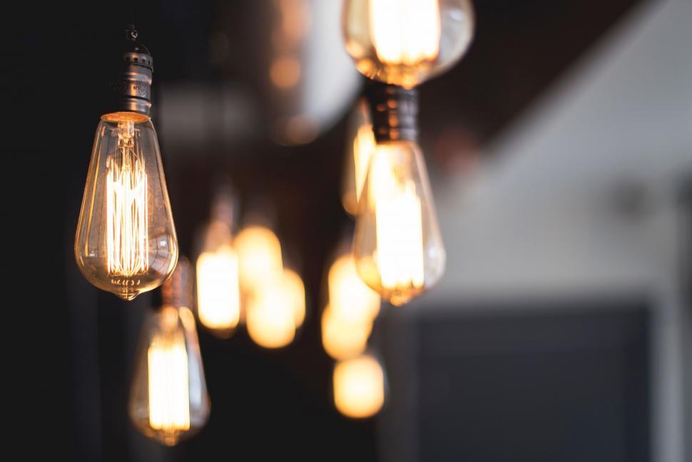 Free Image of Array of Light Bulbs Hanging From Ceiling 