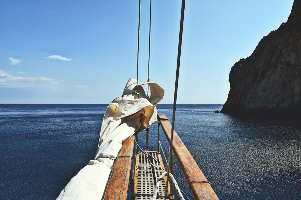 Free Image of Man Sitting on Boat in Ocean 