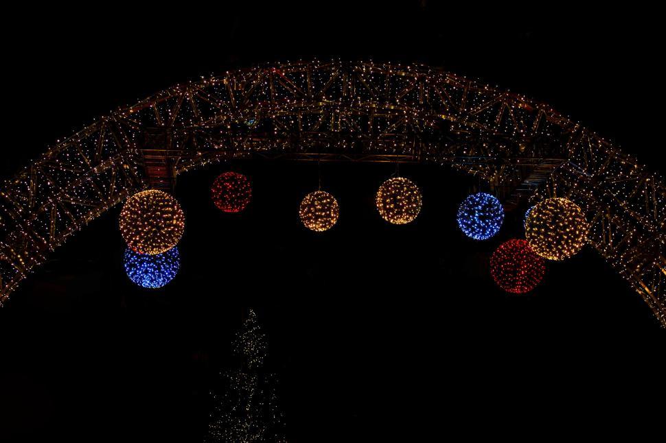 Free Image of Group of Hanging Lights on Building 