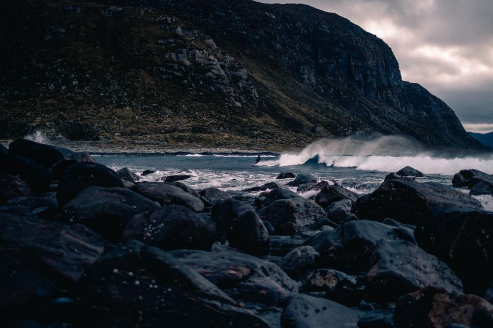 Free Image of Vast Water Body by Rocky Shore 