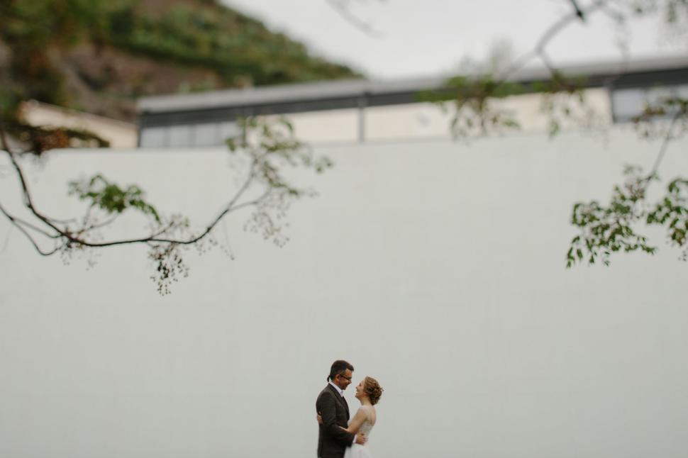 Free Image of Bride and Groom Standing in the Snow 