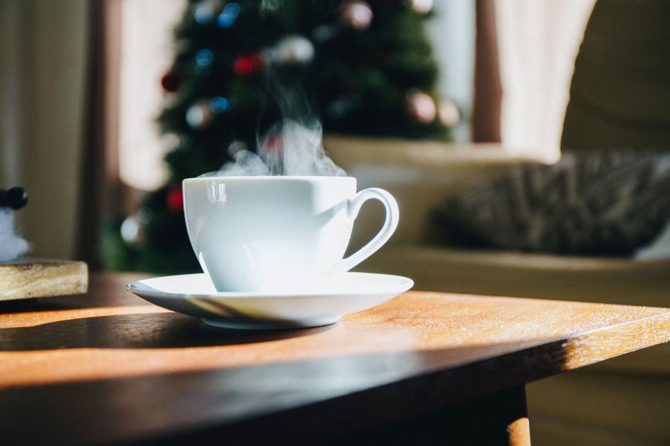 Free Image of A Cup of Steaming Coffee on a Table 