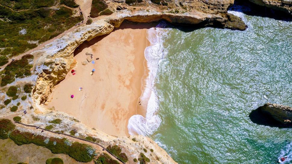 Free Image of Aerial View of Sandy Beach and Ocean 