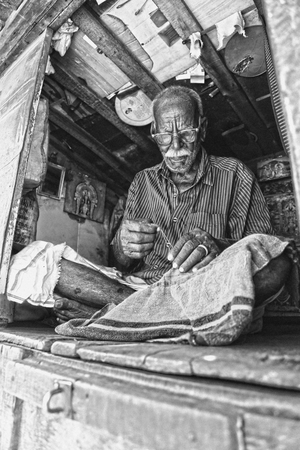 Free Image of Man Working in Back of Truck 