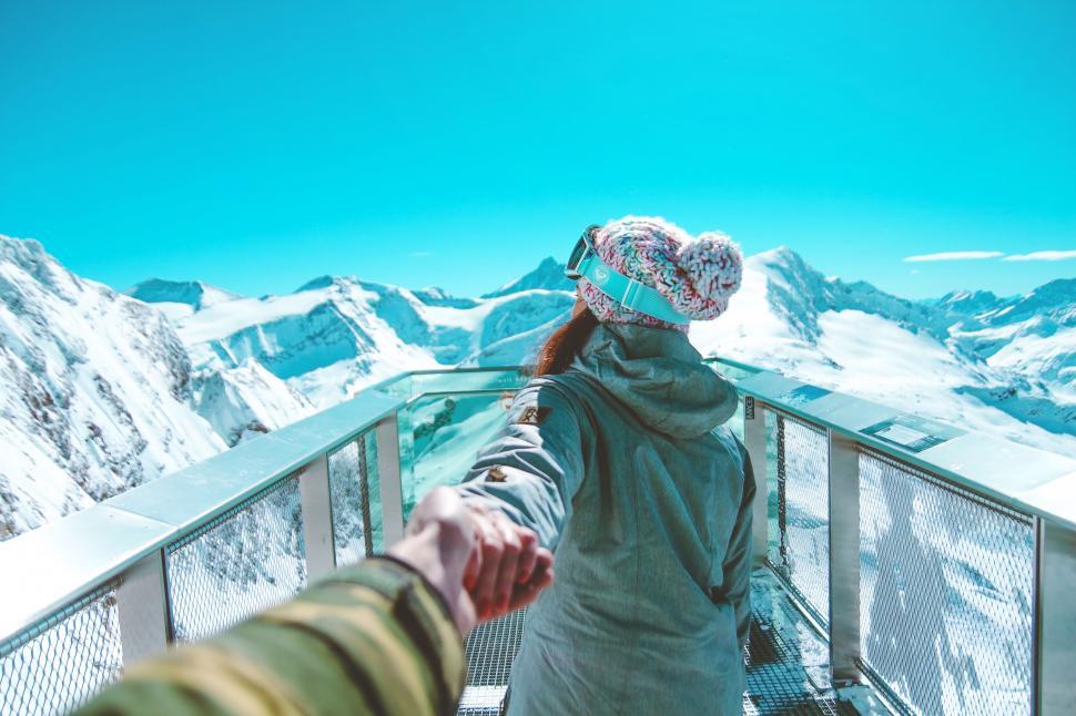 Free Image of Human Connection on Mountain Summit 