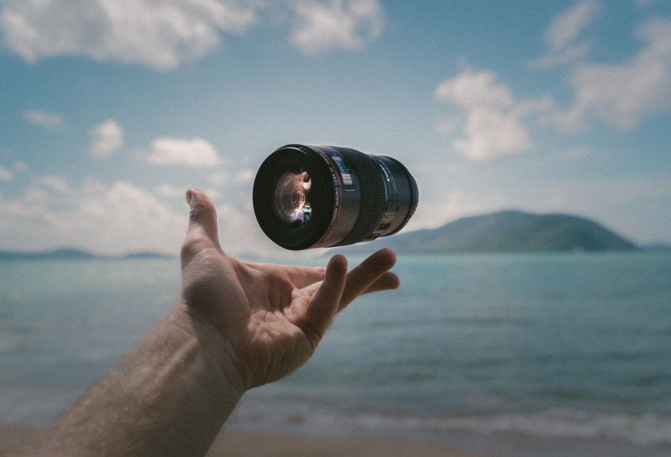 Free Image of Hand Holding Camera Up to Sky 