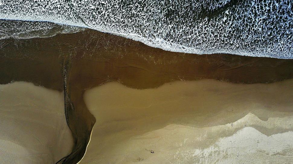 Free Image of Aerial View of Sandy Beach With Waves 