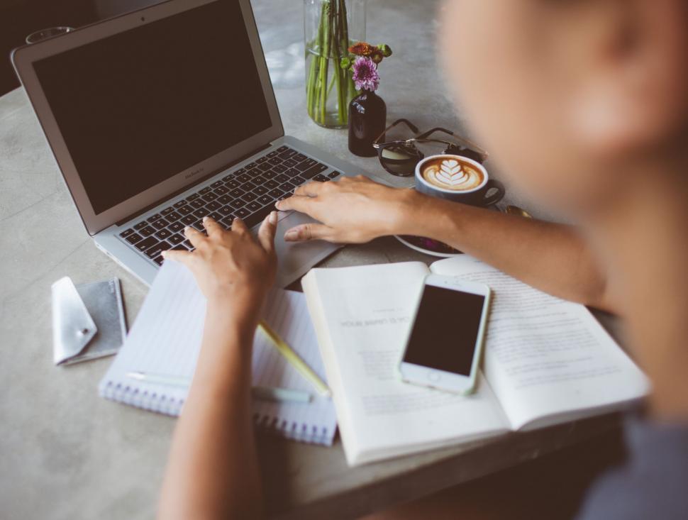 Free Image of Person Working on Laptop at Table 