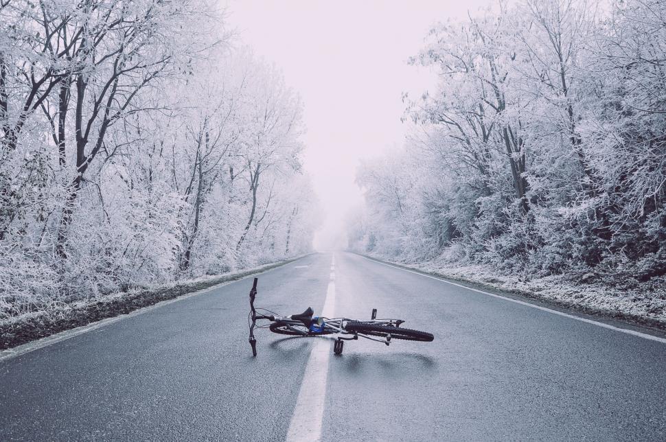Free Image of Bike Laying on Its Side on Roadside 
