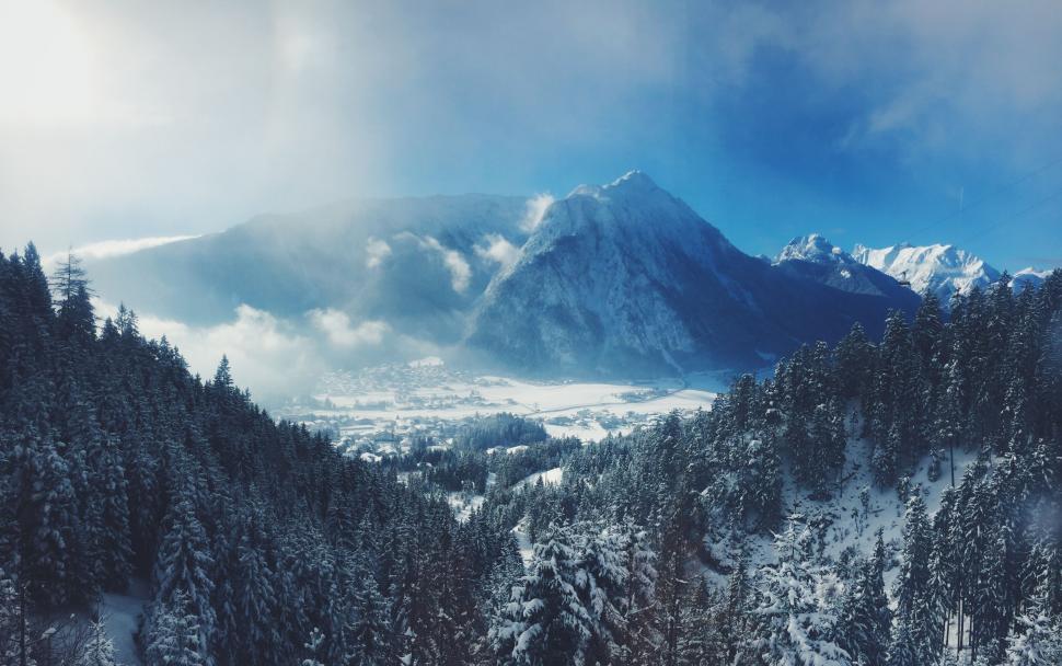 Free Image of Snow-Covered Mountain With Trees 