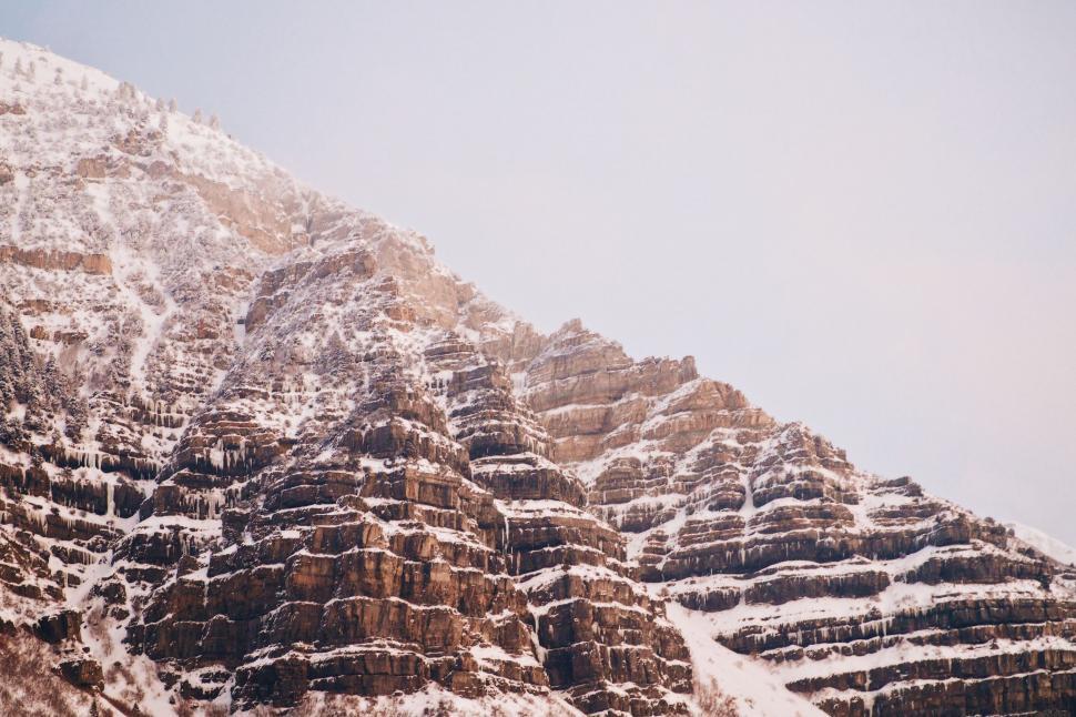 Free Image of Snow-Covered Mountain Under Sky Background 