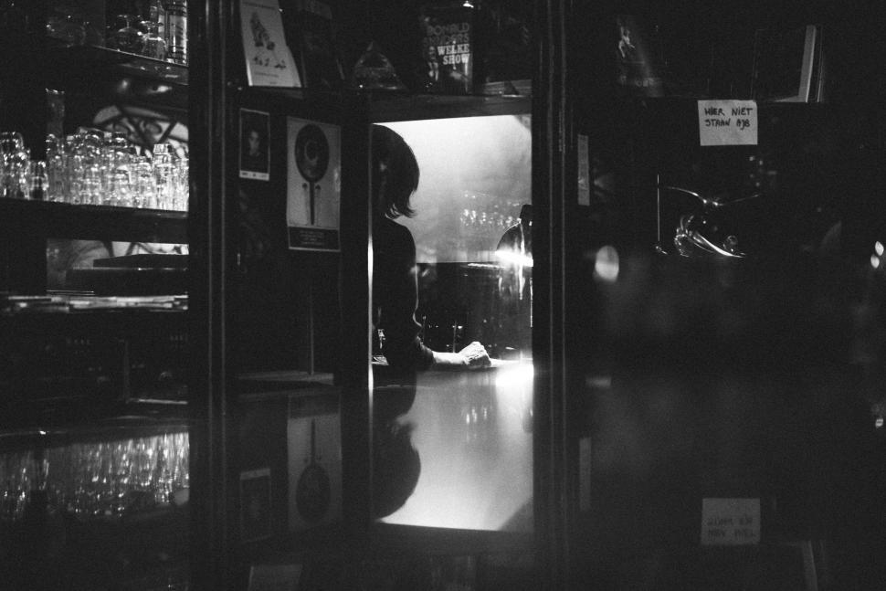 Free Image of Person Standing in Store Doorway 