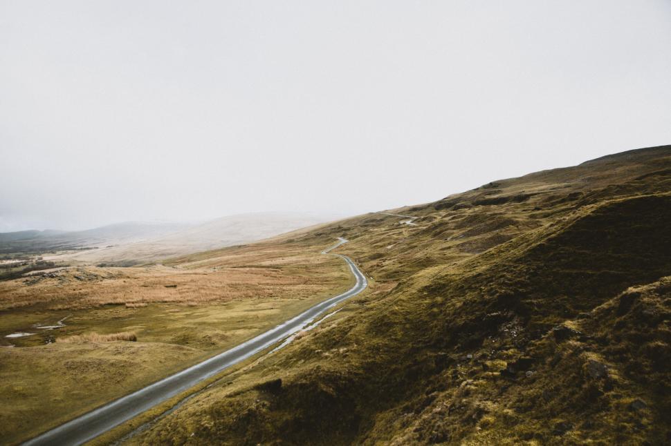 Free Image of Aerial View of Winding Road in Mountains 