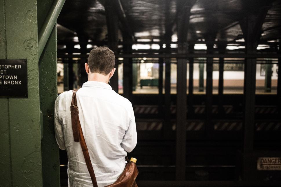 Free Image of Man Standing in Train Station 