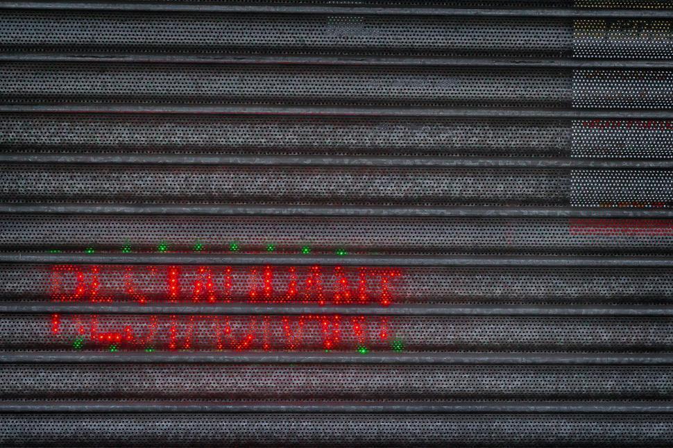 Free Image of Close Up of Red Sign on Building 