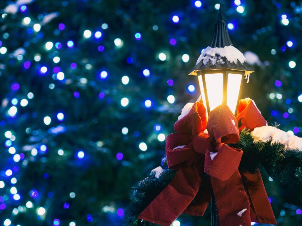 Free Image of Christmas Light Adorned With Red Bow 