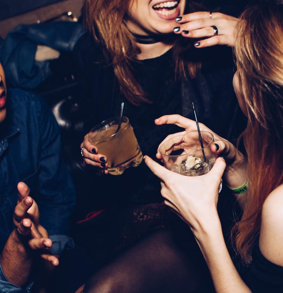 Free Image of Group of People Sitting Next to Each Other 