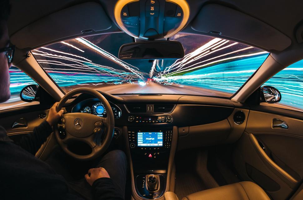 Free Image of Man Driving a Car in the Dark 
