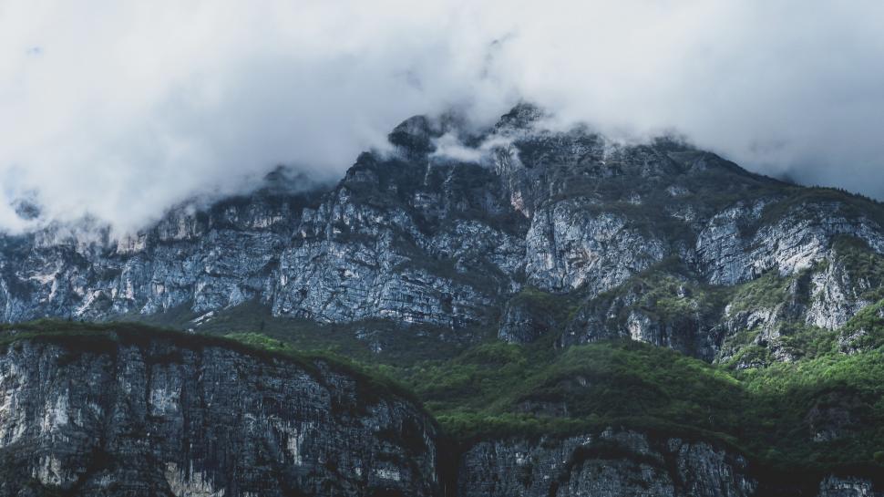 Free Image of Cloud-Covered Mountain With Green Trees 