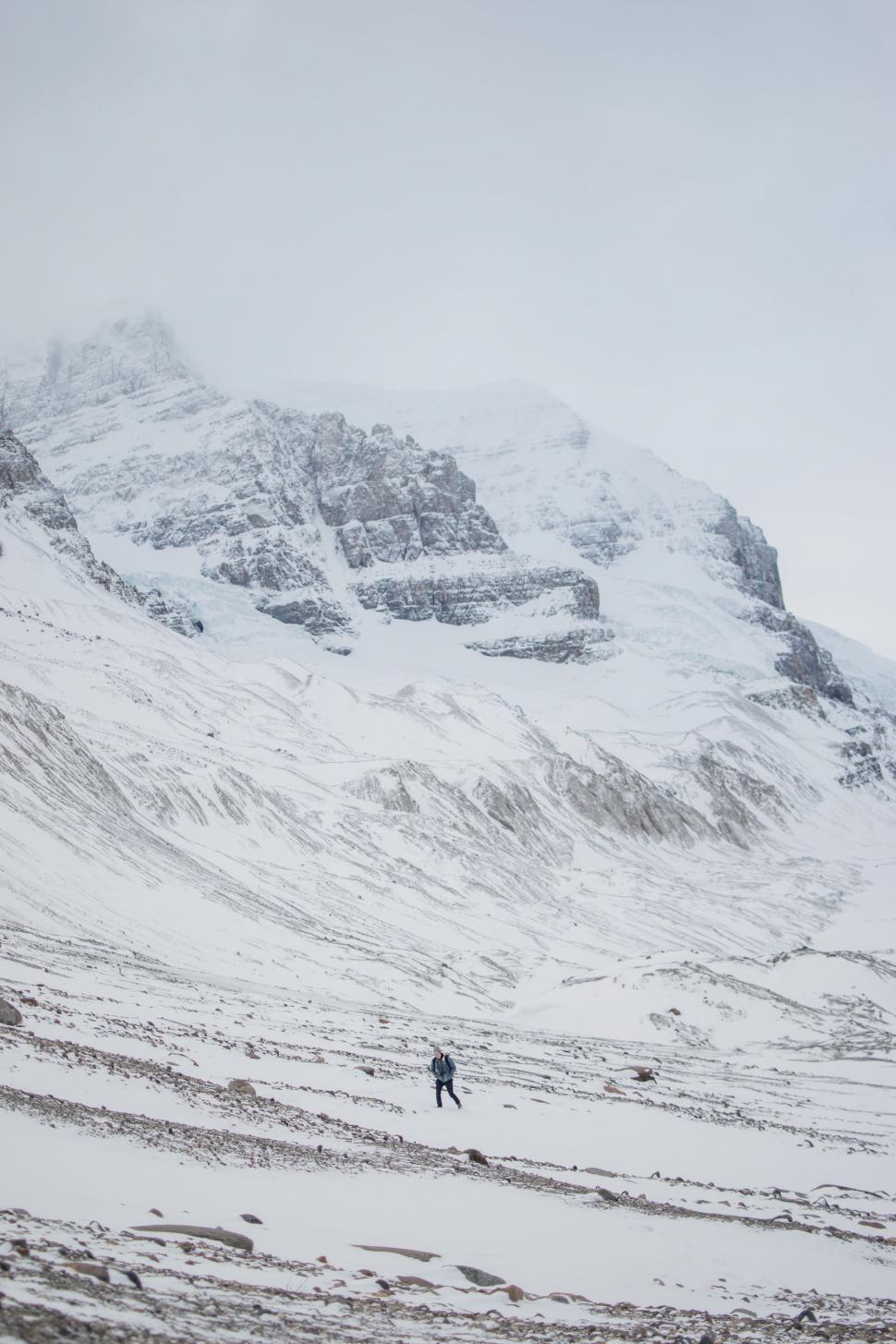 Free Image of Person Skiing Down Snowy Mountain 
