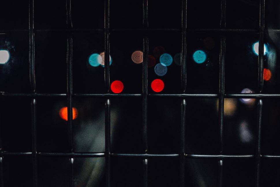 Free Image of Close-Up of Fence With String of Lights 