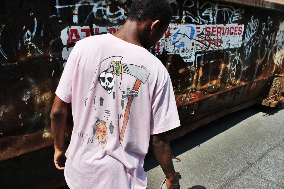 Free Image of Man Walking Past Train on Street 