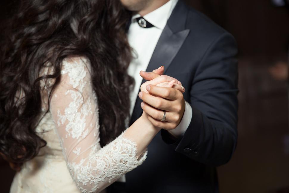 Free Image of Bride and Groom Dancing in Dark Room 
