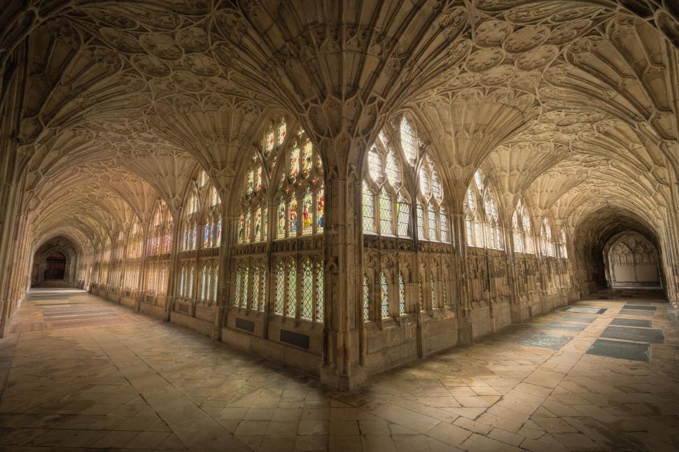 Free Image of Grand Room With Many Windows and Stone Floor 