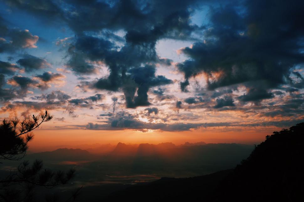 Free Image of Sun Setting Over Mountain Range 
