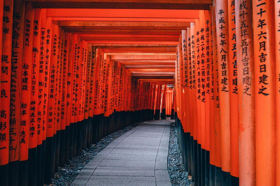 Free Image of Orange and Black Column-Lined Walkway 