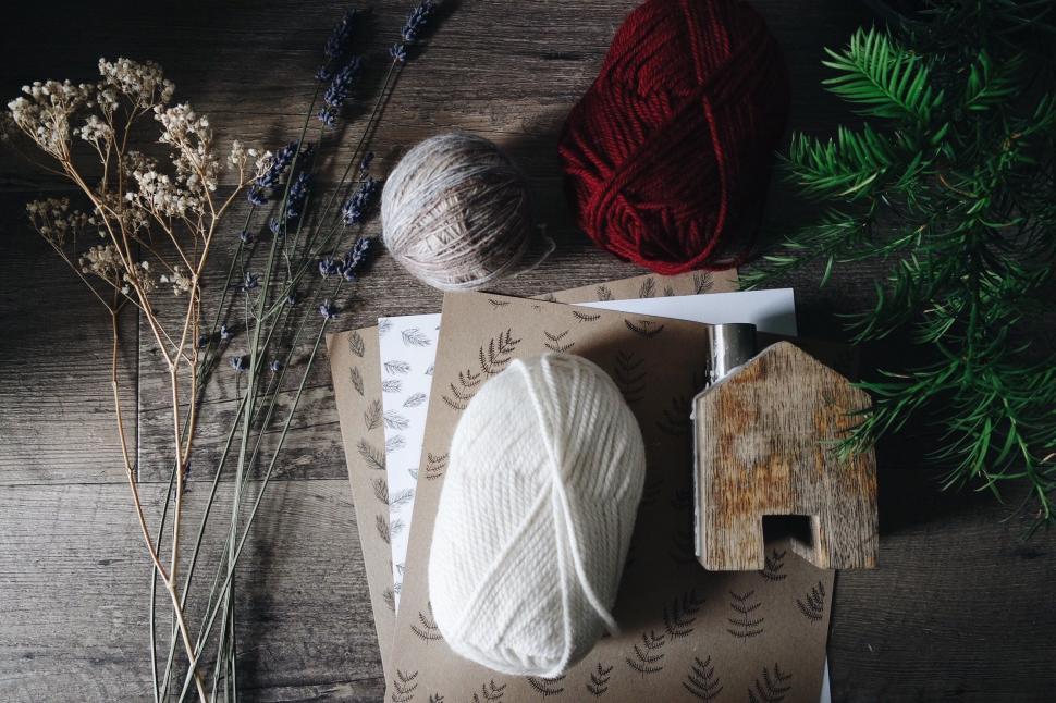 Free Image of Wooden Table With Yarn and Wooden House 