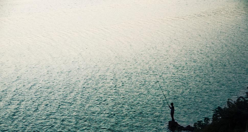 Free Image of Person Parasailing in Large Body of Water 