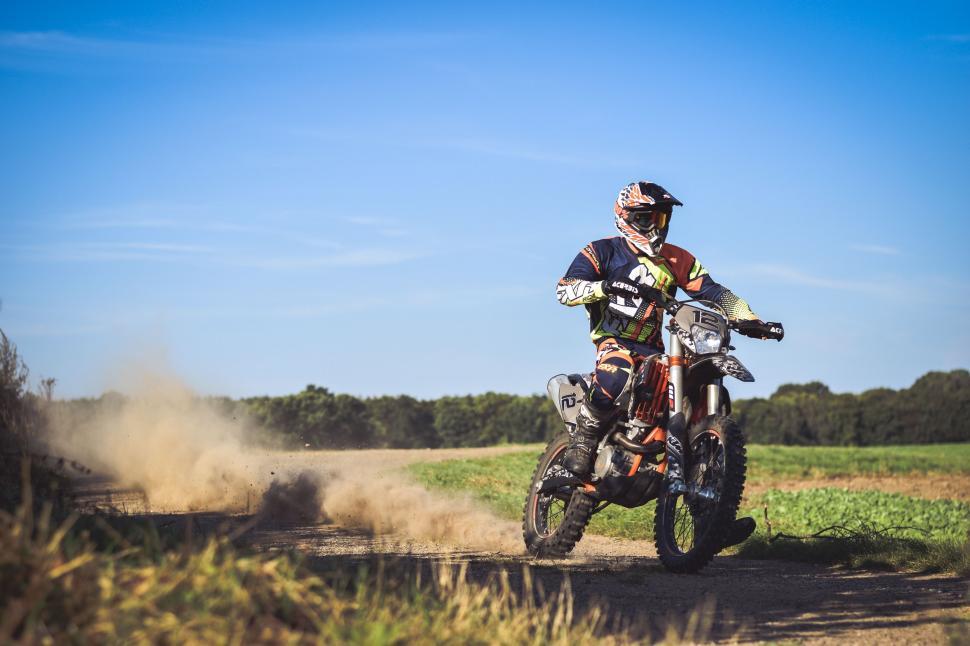 Free Image of Man Riding Dirt Bike on Dirt Road 