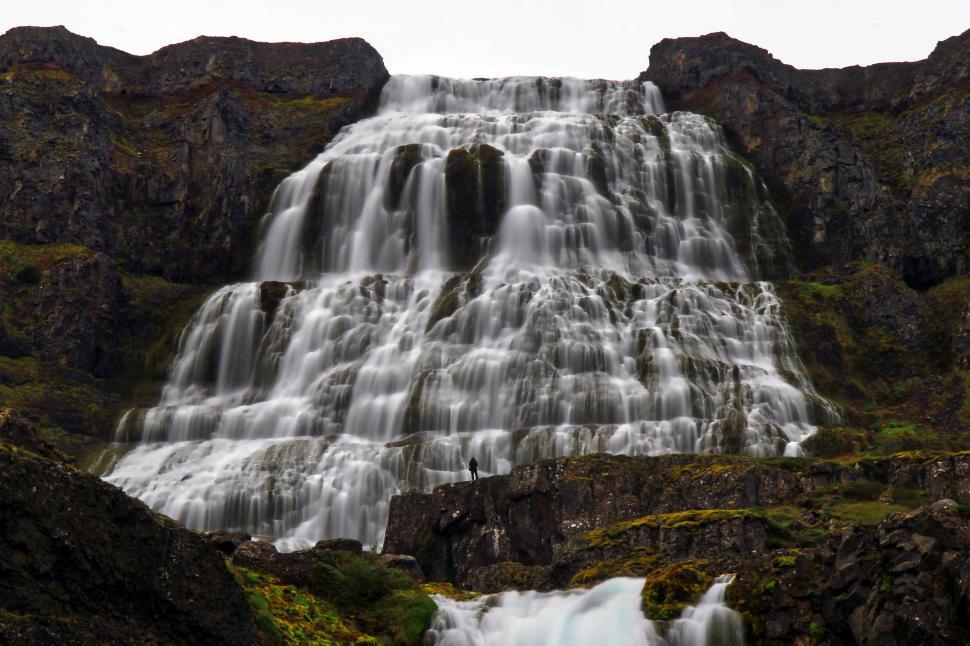 Free Image of Waterfall Flowing With Moss-Covered Rocks 
