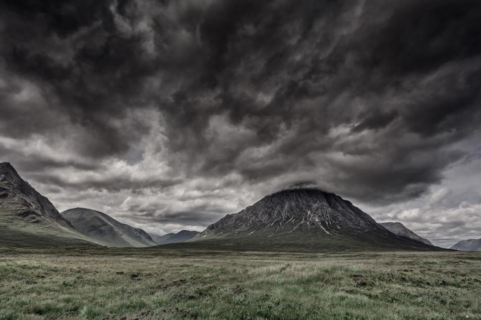 Free Image of Majestic Mountains Under Cloudy Sky 