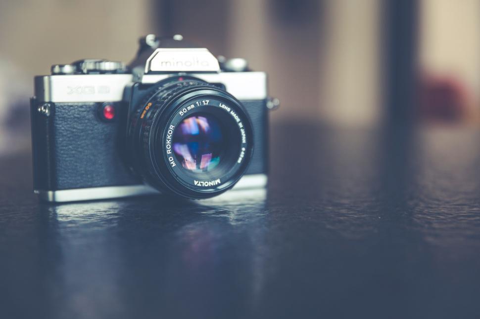 Free Image of Camera on Wooden Table 