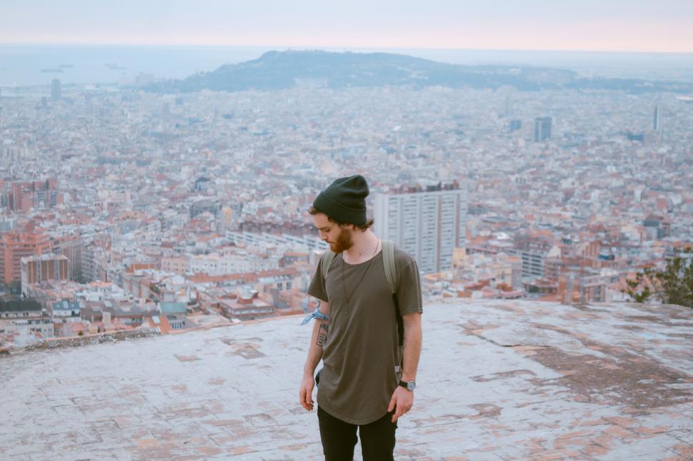 Free Image of Man Standing on Top of Tall Building 