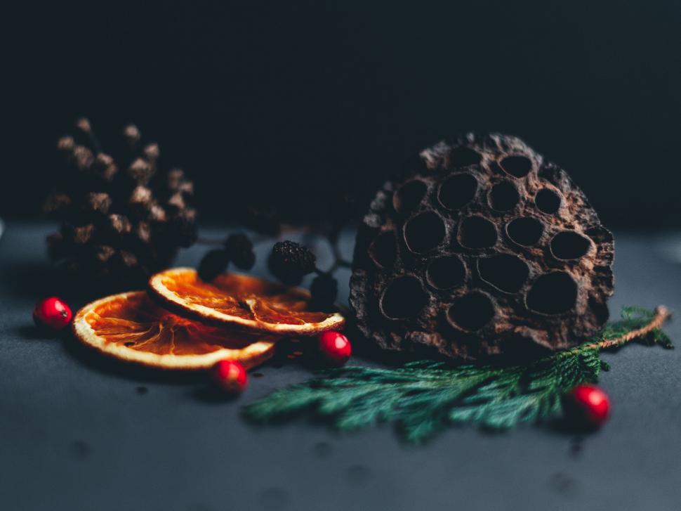 Free Image of Table Topped With Oranges and Pine Cones 