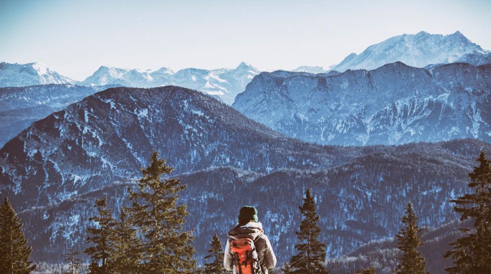 Free Image of Man Standing on Snow Covered Slope 